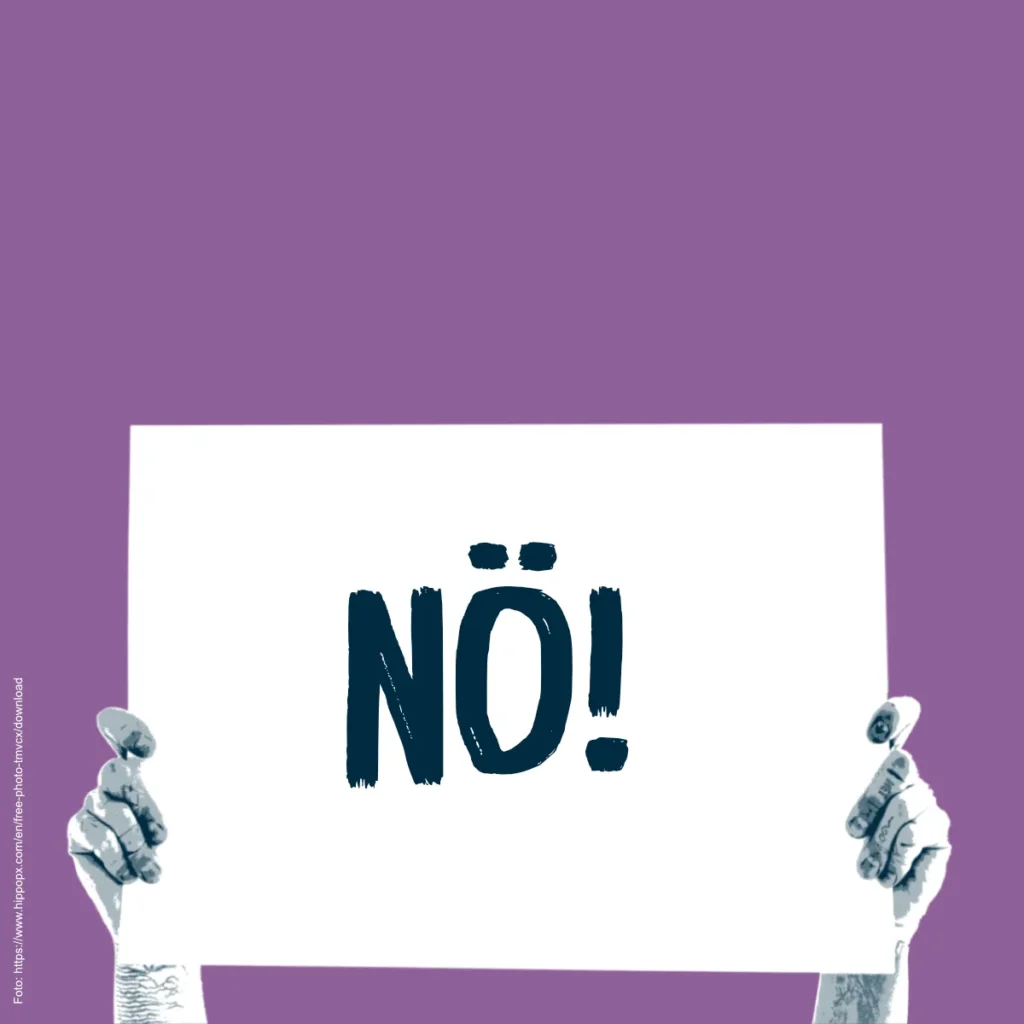 Zwei Hände halten ein Demoschild auf dem "Nö!" steht